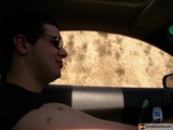 Tattooed Man Behind the Wheel