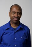 A Happy Black Man in a Blue Dress Shirt
