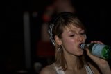 DJ Reid Speed performing with a bottle in hand
