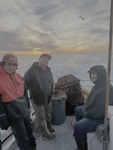 Commercial Fishermen on Boat at Sunrise