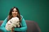 A Happy Woman and Her White Poodle