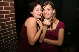 Two Friends Sharing a Joyful Moment at Night