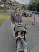 Mother and Toddler on Suburban Street Walk