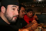 Bearded Man Enjoying a Meal at the Bar