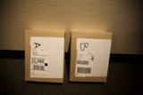 Two Boxes Marked with 'B' on a Table