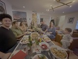 Family Thanksgiving Dinner Gathering Around Table