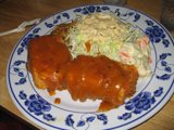 Delicious Plate of Food with a Side of Refreshing Coleslaw