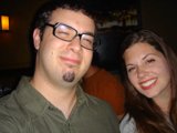 A Happy Couple Wearing Glasses