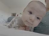 Sweet Baby Portrait on Cozy Bed