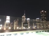 Nighttime Vista of LA's Metropolis from Rooftop Pool