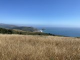 Promontory Overlooking the Majestic Ocean and Hills