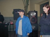 Two Music Enthusiasts Pose for a Candid Shot Amongst Electronics and Greenery