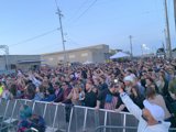 Summer Vibes: A Crowd Gathering at a Concert