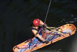 Man in Life Jacket Tackles the Waves