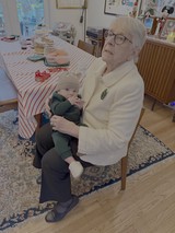 Grandmother's Tender Moment with Baby Grandchild