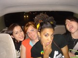 Four Friends Laughing Together in a Vehicle at Night