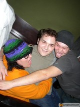 Three Men Embrace
