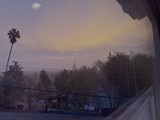 Misty Sunset View from Residential Balcony