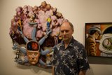 Man next to Portrait of a Head