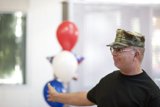 Military Man and Balloons