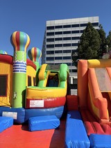 Colorful Inflatable Bounce House at Urban Outdoor Event