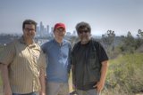 Three Men Enjoying a Sunny Day Outdoors