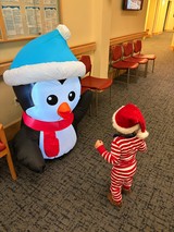 Toddler Meets Inflatable Snowman in Waiting Room