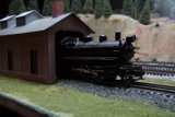 Toy Train Engine Parks in Front of Museum Building