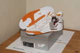 Orange and White Sneakers on a Box