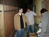 Three Men Holding Hands in Hallway