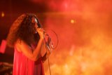 Solange Portrait Hand Gesture Singing Orange Smoke Atmospheric