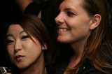 Two Women Sharing a Candid Moment at Night Event
