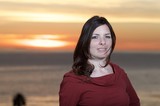 Woman in Red at Golden Hour Seaside Sunset