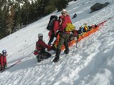 Group Skiing Adventure on Snowy Slope