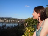 Woman Gazing Serenely Over a Tranquil Lakeside