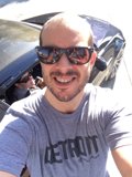 Selfie in Shades with a Stylish Sedan