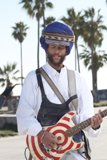 Turbaned Musician Under Blue Sky
