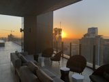 Rooftop Sunset Over Cityscapes