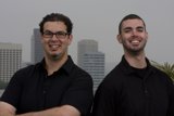 Two Happy Men in Black with Eyeglasses
