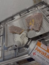 Culinary Torch Caramelizing Meat in Professional Kitchen