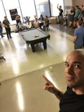 FFW Office All Hands Meeting Selfie Pointing Pool Table Employees Gathered Tech Startup Interior Clear Shot