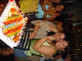 Green Shirted Woman Celebrates with Cake