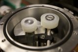 Small White Spoke Wheels in Metal Container