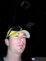 The Man with the Yellow Hat and Shades