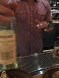 Savoring a glass of red wine in a Detroit bar