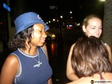 Three Women on City Streets at Night