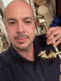 Dave B Holding a Brass Shower Head