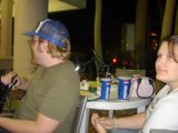 Man in Baseball Hat Sitting at Table