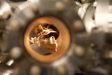 Fiery Alloy: A Close-Up of a Car Wheel Spoke