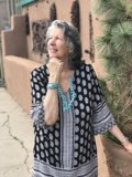 Polka-Dotted Lady Poses Among New Mexico Trees